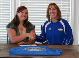 Hollind Englert and Bethany head softball coach Janice Esses